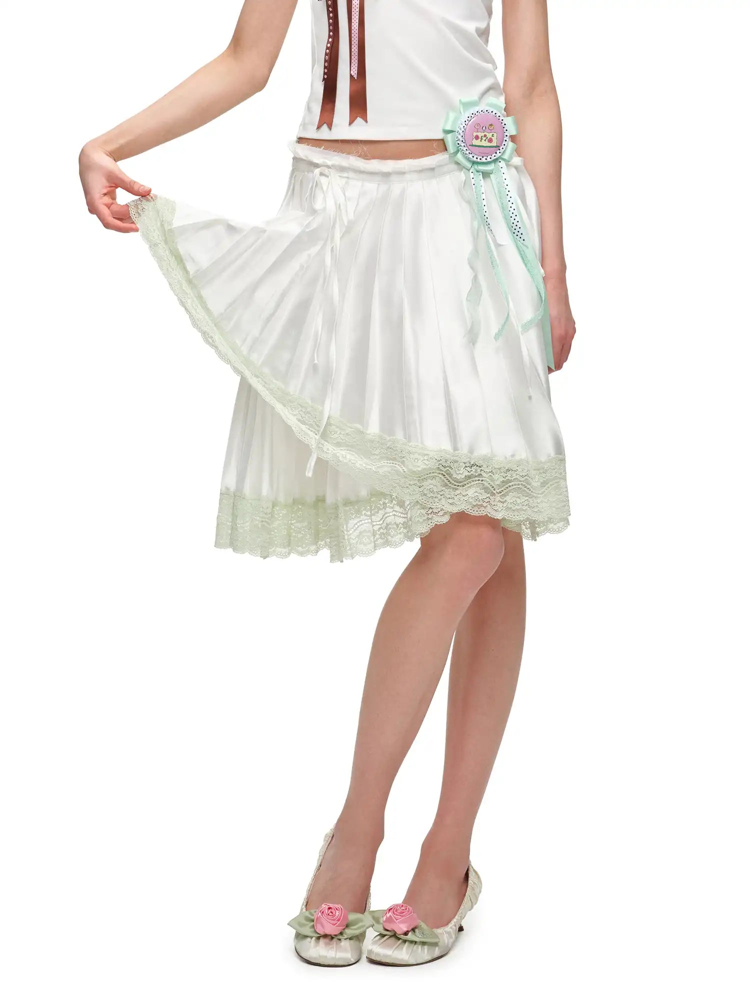 1Jinn Studio Lace Trim Asymmetric Hem Bow Waist Pleated Skirt | Canton Collective