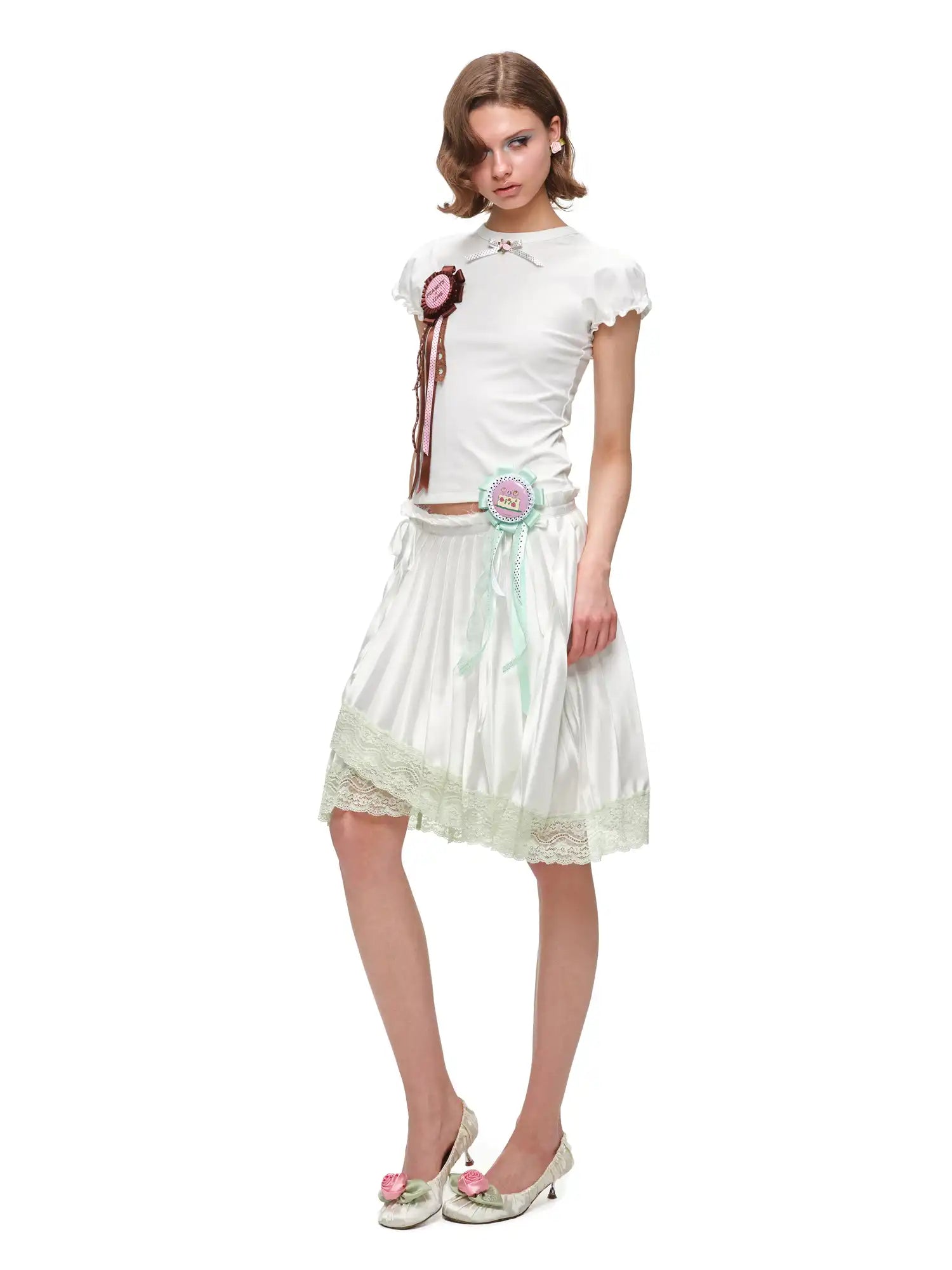 1Jinn Studio Lace Trim Asymmetric Hem Bow Waist Pleated Skirt | Canton Collective