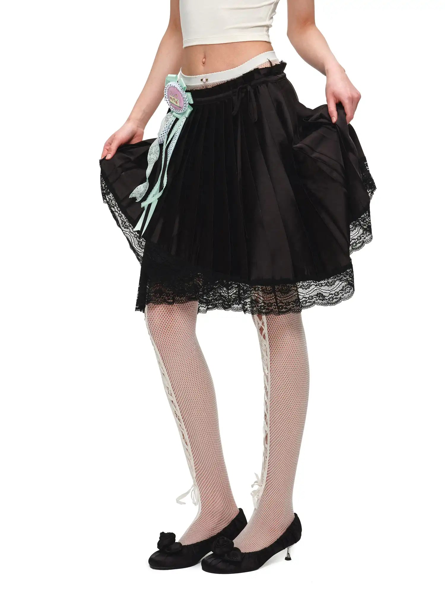 1Jinn Studio Lace Trim Asymmetric Hem Bow Waist Pleated Skirt | Canton Collective