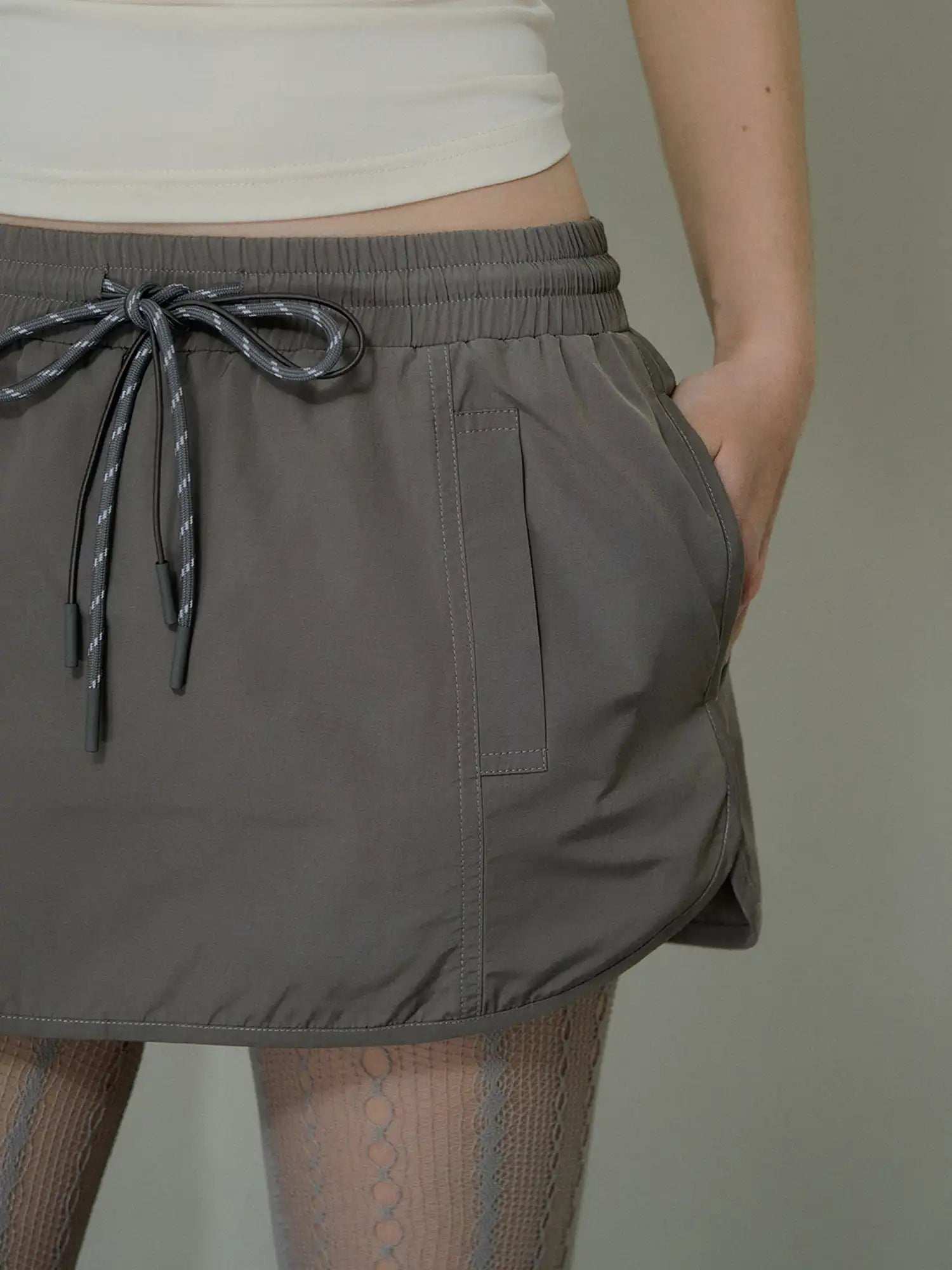 Deleteex Low-Rise Drawstring Nylon Mini Cargo Skirt | Canton Collective