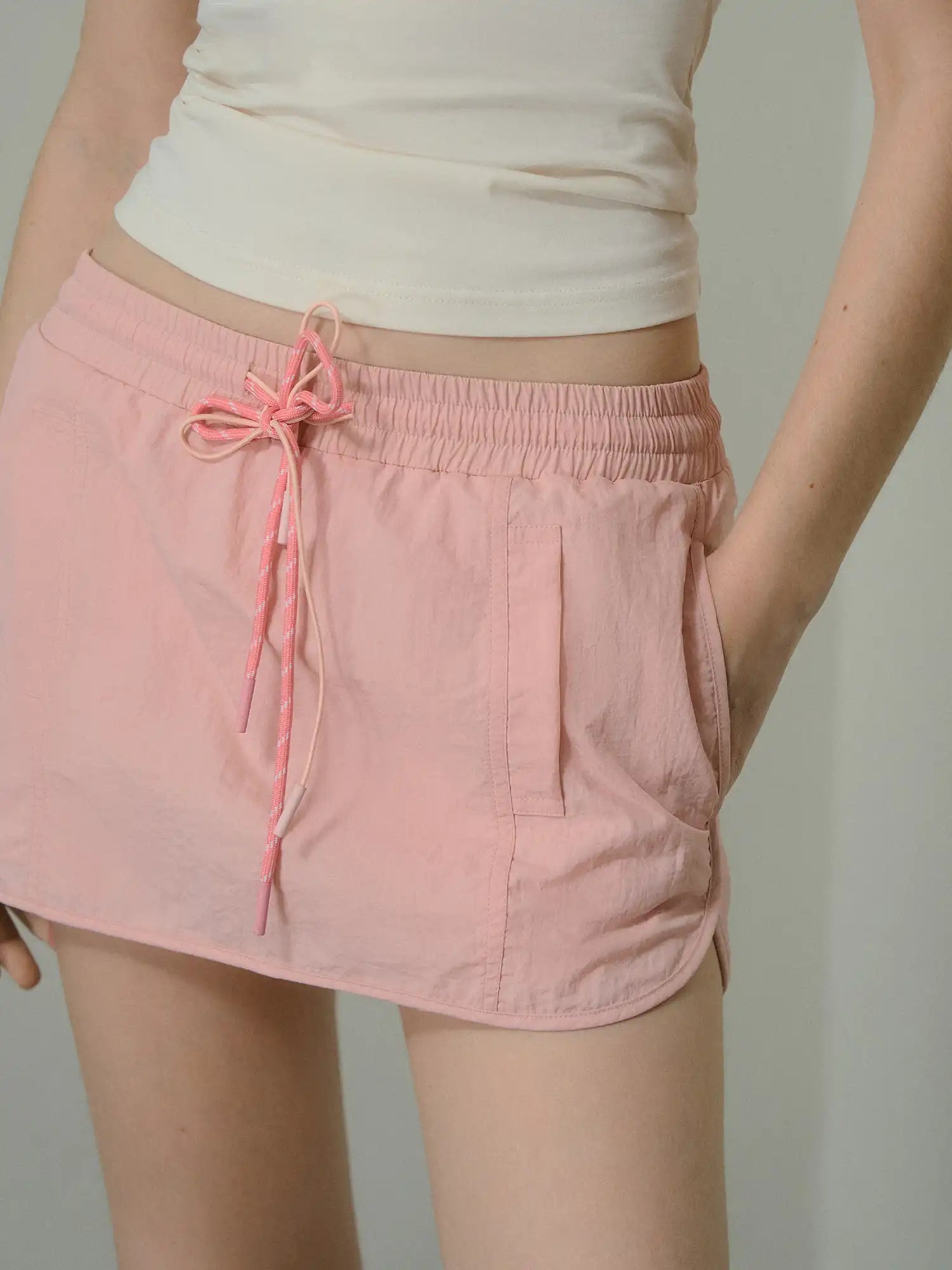 Deleteex Low-Rise Drawstring Nylon Mini Cargo Skirt | Canton Collective